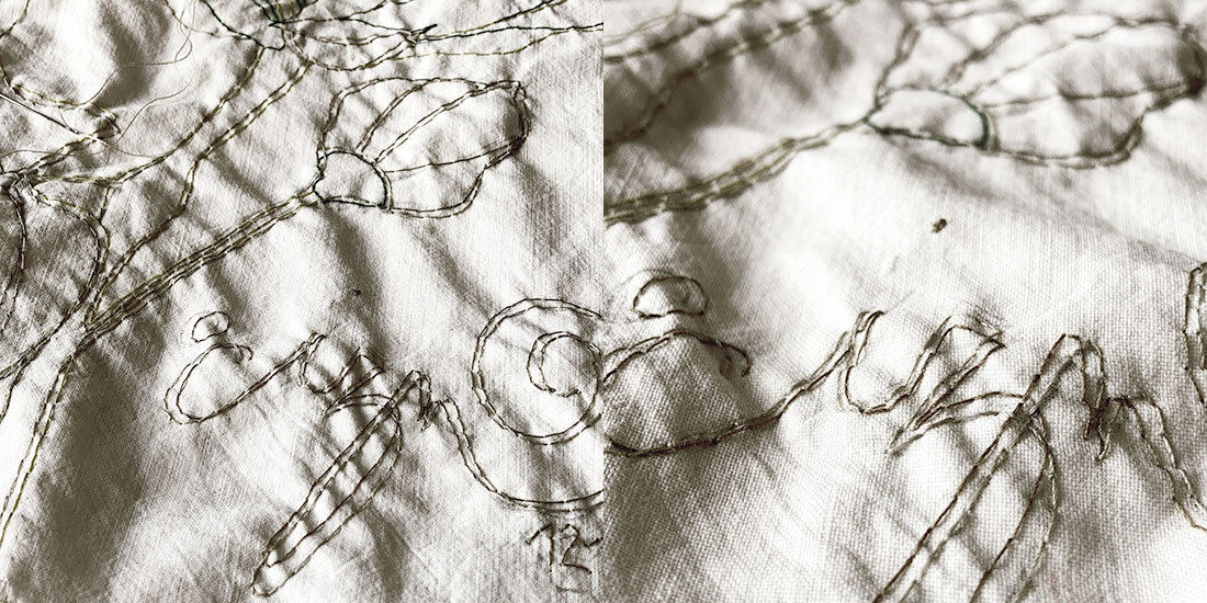 artigianato artistico contemporaneo, ricamo con grandi fiori su stoffa bianca